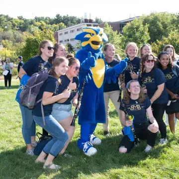 BMB students with Blu on the mall grass 